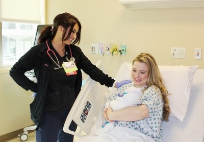 mom and baby with nurse